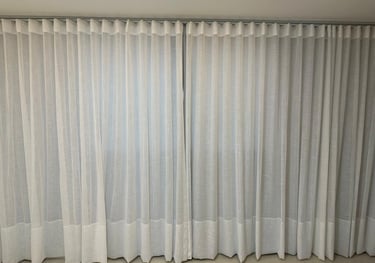 a curtained window with curtains and curtains