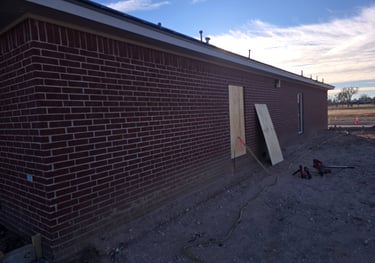 before the brick demolition begins with boarded windows by Contractor