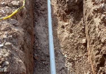 One eighth per foot drop of pvc installed by Red Dirt Ditching and Septic LLC. Call 806-782-5800