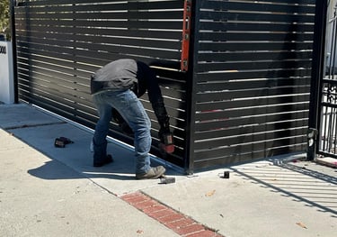 Garage Door Wizards team installing gate and fence