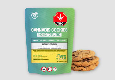 A package of Northern Lights indica cannabis cookies containing 100mg THC next to fresh chocolate chip edibles.