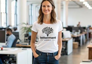 Woman wearing a Betterment Agenct T-shirt in an office