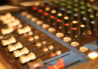 mixing board recording studio audio production knobs faders