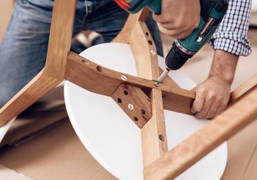 Turnover Fix & Shine tech assembling a table.