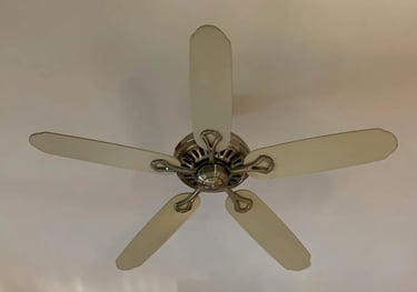 a ceiling fan with a white ceiling fan