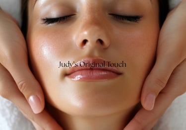a woman getting a facial massage at a spa