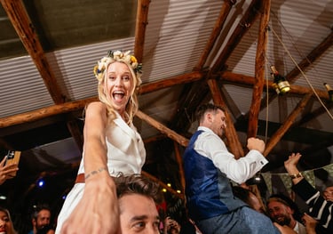 a bride and groomsmid dancing at a wedding