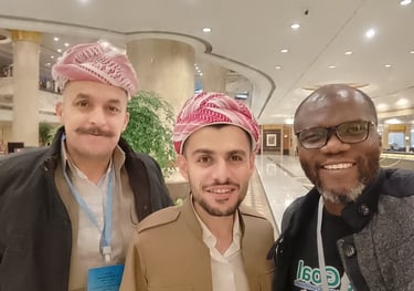 three men standing next to each other in a lobby