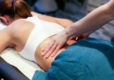 Sports Therapist providing a back massage to a client