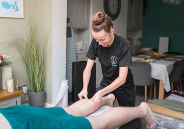 Sports Therapist providing a massage to a client