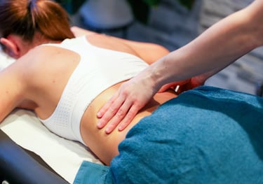Sports Therapist providing a back massage to a client