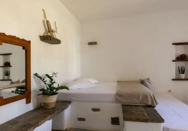 a studio with a comfortable double bed