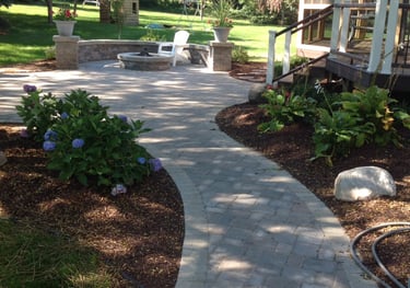 Leppek Landscapes designed and installed landscape patio, fire pit and wall.