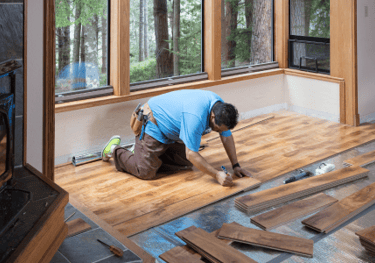 Floor installation with hardwood flooring by Uprise Renovation