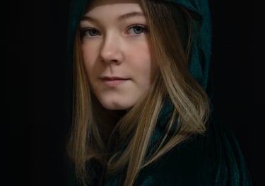 Film production company: woman in a green robe and black jacket