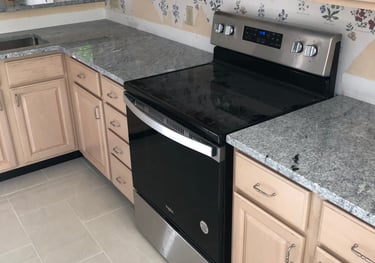 a kitchen with custom herringbone tiling