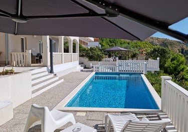 View from the west sun terrace of the pool, apartment balcony and the east sun terrace.