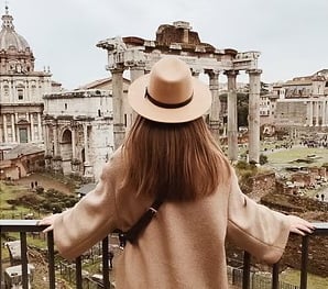 Traveller viewing an ancient ruin. Travel With Character Link.