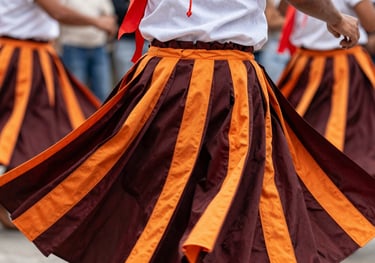 A close-up photograph of a vibrant cultural dance performance at a South American / Brazilian / Bolivian festival, showing movement and colorful deep mahogany and orange ribbons.
