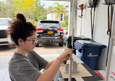 FL DECA Sunshine Skyway bridge being assembled with popsicle sticks and wood, showcasing teamwork an