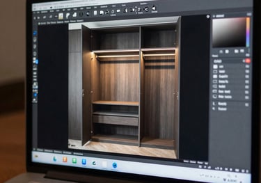 A close-up of a laptop screen displaying a professional CAD 3D model of a modern wardrobe interior with integrated lighting.