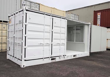 Modified white shipping container with an open side door used for portable storage or mobile office.