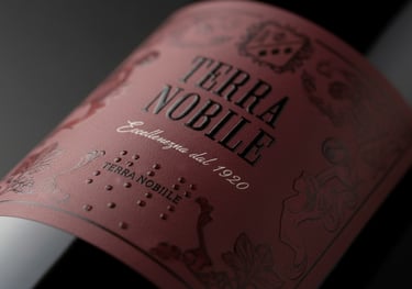 Close-up of a Terra Nobile red wine label with elegant embossed texture and braille details.