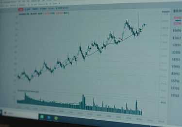 Close-up of a high-resolution trading monitor displaying clean, professional price action charts with a muted teal and slate blue color palette.