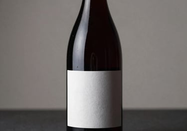 Elegant studio photography of a premium red wine bottle with a minimalist label, placed on a dark surface with soft side lighting highlighting its silhouette.