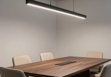 Contemporary office meeting room with a large dark wood table, beige upholstered chairs, and a striking black minimalist light fixture.