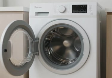 A modern washing machine in a clean, dedicated laundry area within the premises, highlighting the convenience of on-site laundry facilities.