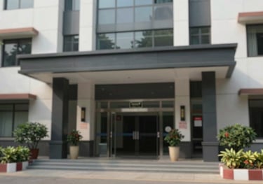 A high-security building entrance with a professional look, showcasing a safe neighborhood environment in Goregaon West with modern architecture.