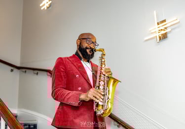 London saxophonist performer in red jacket with gold saxophone - professional music entertainment