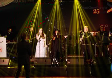 London corporate event saxophonist with live band performing on stage - professional entertainment