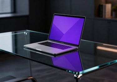 Futuristic glass desk with a slim laptop reflecting purple neon lights in a dark, high-end office in Santiago de Chile.
