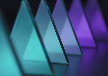 An abstract, professional shot of light refracting through glass prisms, creating a spectrum of cyan and purple light, professional and futuristic.