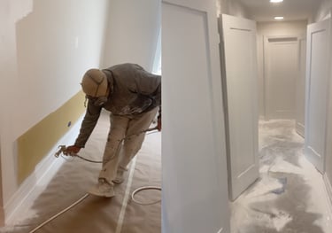 Professional painter using an airless paint sprayer on baseboards and white interior doors.