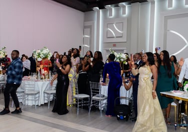 A picture of attendees of a Luxelite event with people capturing the moment with their phones.