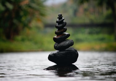A small cairn with multiple levels representing the delicate balance of recovery.