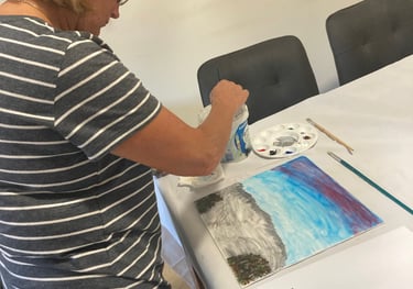 a woman is painting a picture of a painting