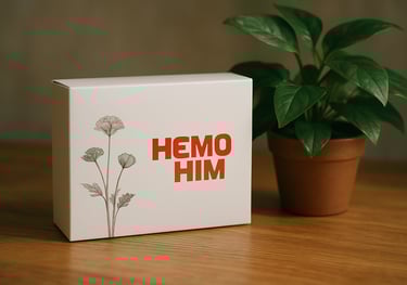 A professional shot of a box of HemoHim supplements on a wooden table next to a green plant. The lighting is soft and natural, emphasizing a healthy lifestyle and high-quality manufacturing.