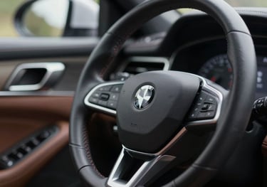 Close-up of a luxury car's interior dashboard and steering wheel, reflecting polished surfaces and a sense of achievement and mobility.