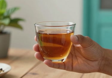 A professional photography of a hand holding a warm cup of tea in a Latin American home, with soft focus on the background showing mint and teal accents, symbolizing self-care.