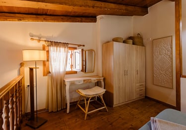 Tonia's cottage bedroom with a desk and a chair
