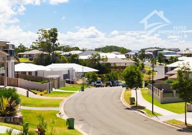 a street scene with a car parked on the side of the road