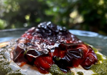 a plate of food with a green and red sauce