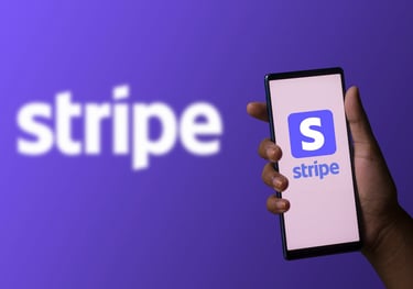 a person holding a phone with a logo on it