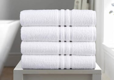 a stack of towels and a towel on a table