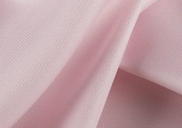 a pink fabric covered fabric with a white background