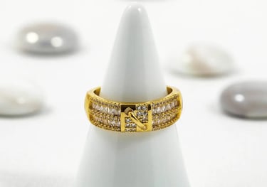a ring with a diamond ring on top of a white cone